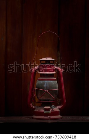Vintage oil lamp on wooden table still life picture