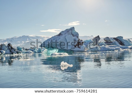 Beatufil vibrant picture of icelandic glacier and glacier lagoon with water and ice in cold blue tones, Iceland, Glacier Bay