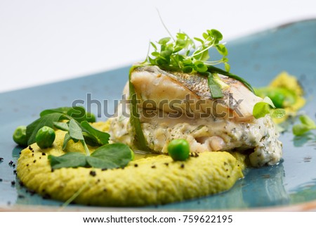 Boiled river fish with white herbs sauce and mashed chickpeas puree Royalty-Free Stock Photo #759622195