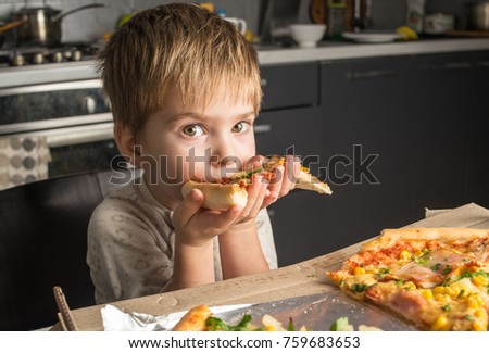 Closeup on happy eating pizza on the wooden table. Hands taking pizza from table, closeup. food, leisure and friendship lifestyle