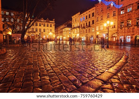 Evening street with benches and lanterns. Night European city