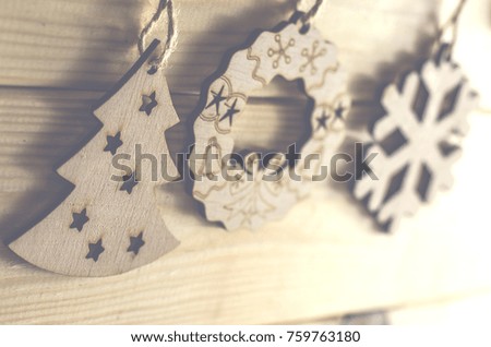New Year's holiday wooden toys on a wooden background