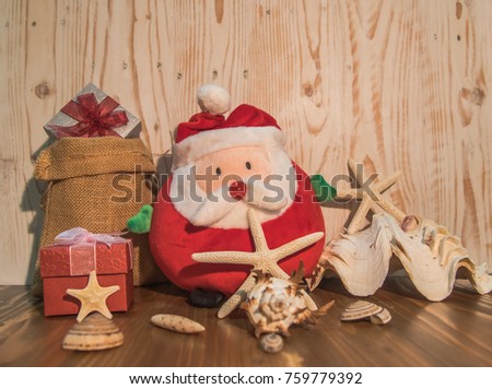 Christmas card with decoration on a wooden table with santa and gifts, Wooden background.