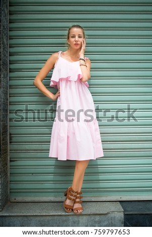 
Young beautiful girl on the streets of asia in beautiful clothes
