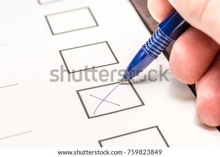 With a pen a cross is made to the vote