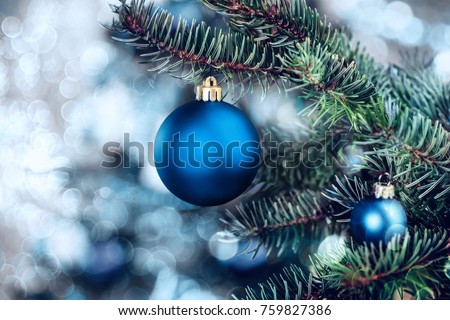 Christmas background - baubles and branch of spruce tree Royalty-Free Stock Photo #759827386