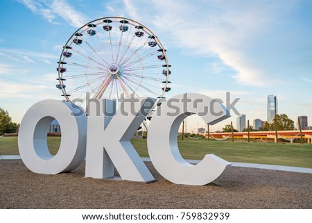 Skyline of Oklahoma City, OK with OKC sign and ferris wheel Royalty-Free Stock Photo #759832939