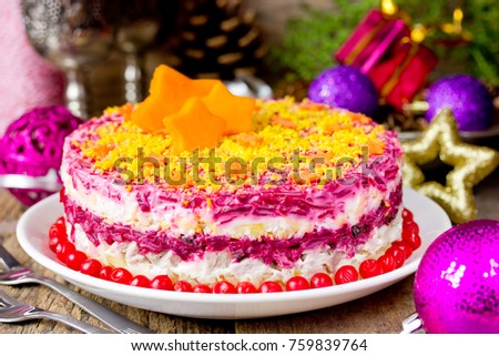 Herring under fur coat. Shuba salad. Russian layered salad with beet, potato, carrot, egg, pickled herring and mayonnaise for Christmas dinner