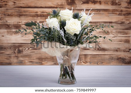 Bouquet of fresh white yellow roses on retro vintage background