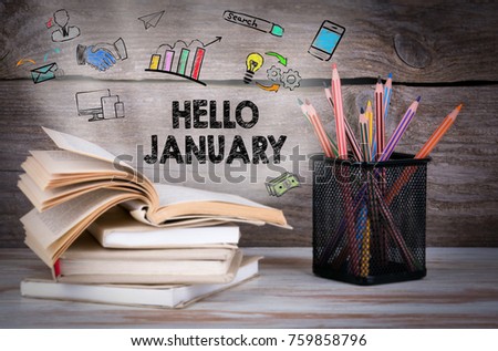 hello january, Business Concept. Stack of books and pencils on the wooden table.