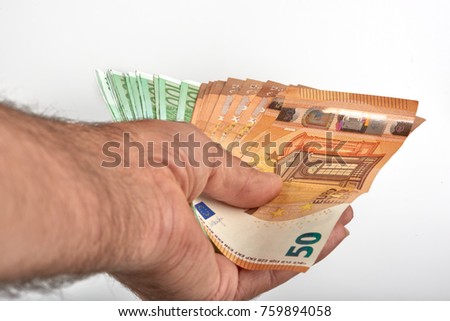 Man hand with money isolated on white background