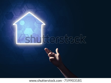 Hand of man touching with finger glowing home icon or symbol