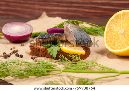 Herring sandwich with lemon and onion