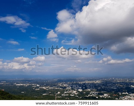 city under sky and cloud