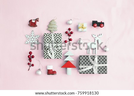 Christmas decorative ornaments and gifts on pastel background in vintage color