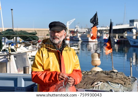 portrait of a fisherman in the harbor Royalty-Free Stock Photo #759930043