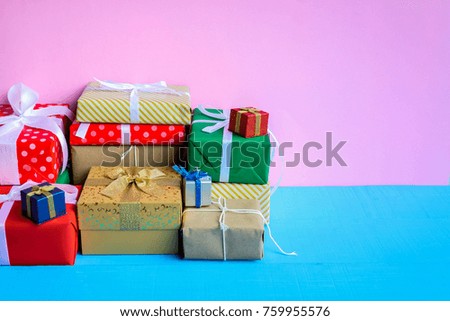 gift boxes on wood desk pink wall background and color pastel with the holiday season