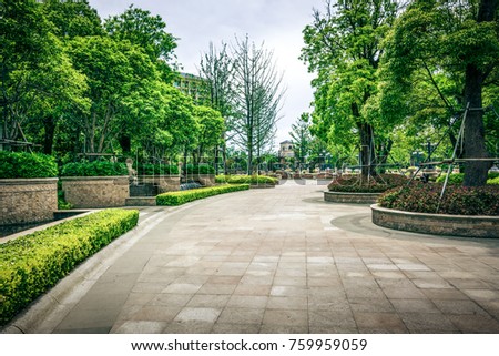 green grass field in big city park Royalty-Free Stock Photo #759959059