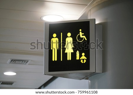 restroom sign inside the airport building