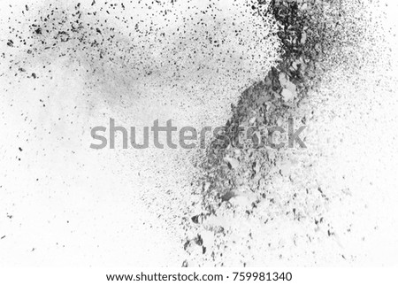 Freeze motion of white dust explosion on black background.