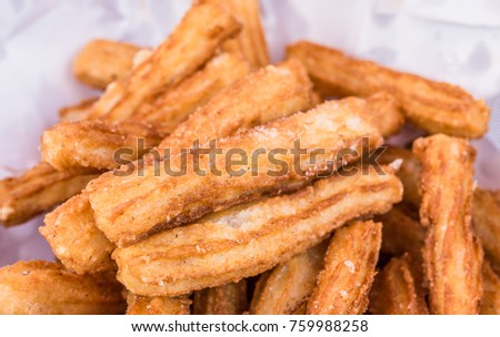 Close up of traditional Spanish churros dessert at a street food market