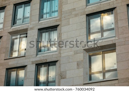 hdr picture of office facade with warm cloud reflections