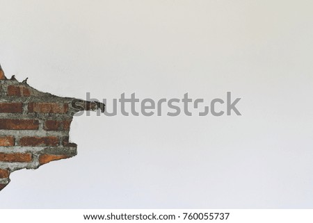 White concrete red brick wall with peeling plaster. Urban vintage texture background.