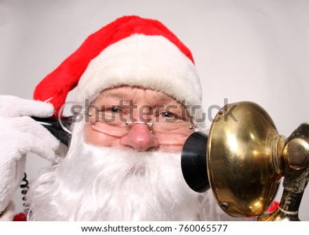 Santa Claus talks on his Golden Candle Stick Telephone. Santa on the Telephone