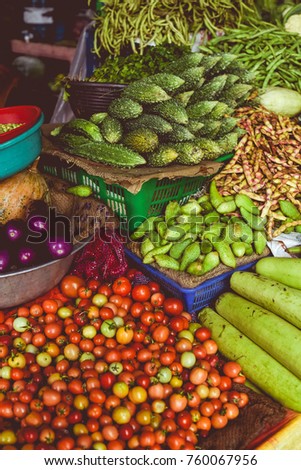 Different colorful and fresh vegetables sold in a market