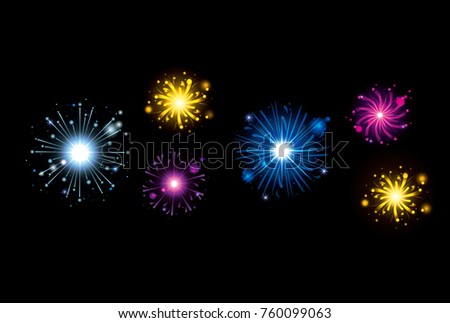 fireworks bursting in glowing multi colours on black background