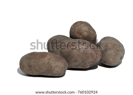 natural dirty potato tubers with natural defects on a white background