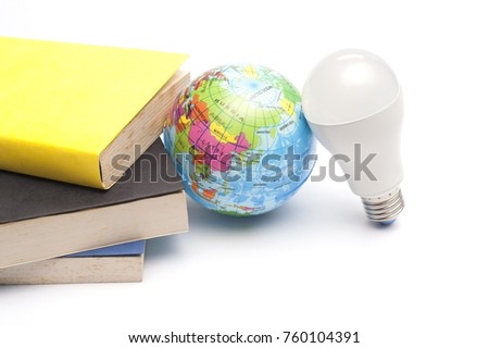 Creative Lay Out of Books,World Globe Ball and Light bulb isolated over white background.Global Idea concept.