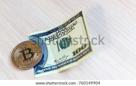Bitcoin on crushed dollar banknote concept of conspiracy
