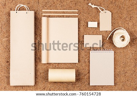 Eco blank packaging, stationery, gifts template of  kraft paper  on   brown coconut fiber background. 