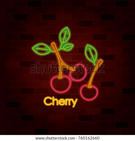 cherry fruit on neon sign on brick wall