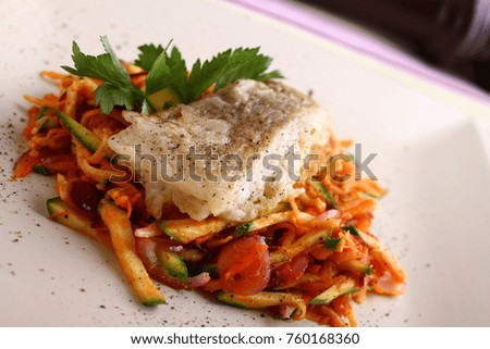 fish fillet with vegetables garnish