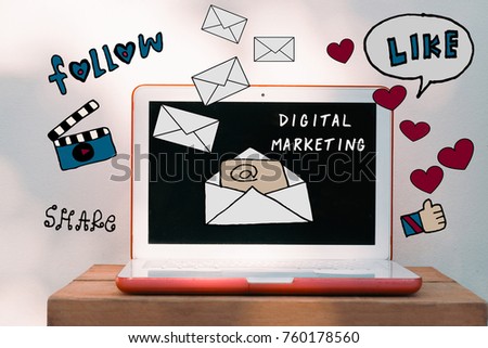 Laptop computer on wood desk with mail illustrator doodles - Email marketing and  Digital marketing concept