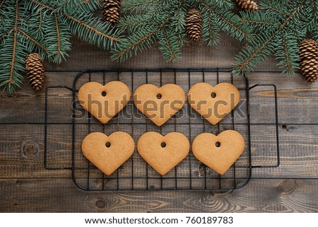 Cookies in the form of hearts on a wooden background