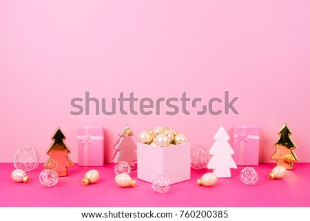 Christmas tree balls on a pink background with a place for your text.