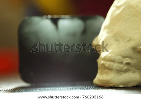 Artifitial skull put beside the film.