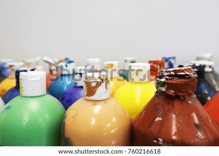 used colourful paint bottles in the art room