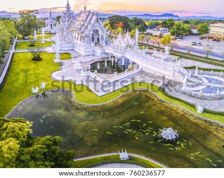 Aerial view beautiful ornate white temple located in Chiang Rai northern Thailand. Wat Rong Khun (White Temple), is a contemporary unconventional Buddhist temple.