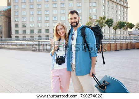 Couple of young tourists outdoors