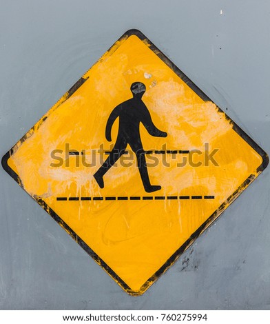 Faded pedestrian crossing road sign background