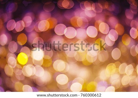 Gold and purple abstract bokeh background glittering stars for christmas and new year event.
