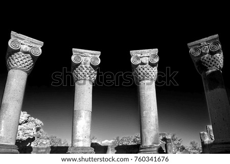ancient columns of the unique stone ruins of the Zvartnots temple, 640th years. AD, Armenia. Ancient architecture. Black and white photography. Low angle view