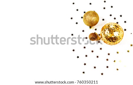 Christmas composition. a pattern of golden christmas balls and stars from above. Flat lay, top view
