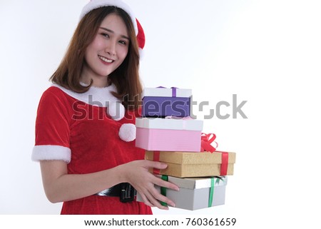 portrait of asian woman in santa claus dress on white background. girl with gift present box. christmas holiday. merry xmas celebration. season's greetings