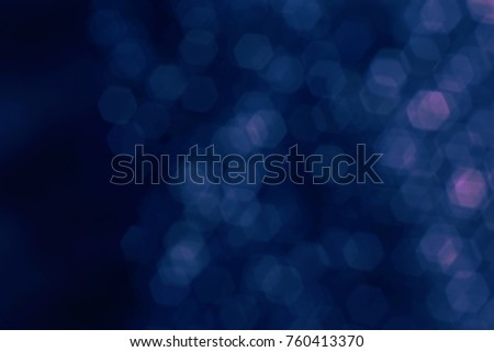 purple glitter vintage lights in dark background,defocused