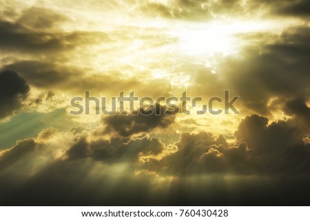 dramatic golden clouds sky with sun rays background